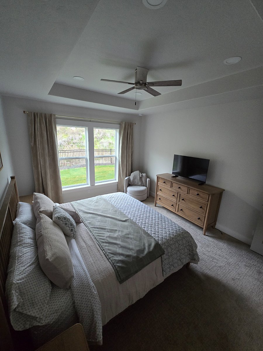 The master bedroom offers a private view of the backyard and foothills, creating a serene and scenic atmosphere. Additionally, a 43" smart TV is provided in the room for your entertainment and private relaxation whenever needed.