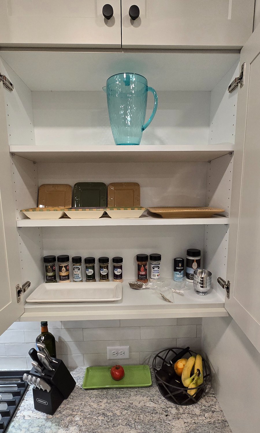 Starter spices and serving dishes are conveniently stored and ready for use, making it easy to create delicious meals and serve with style.
