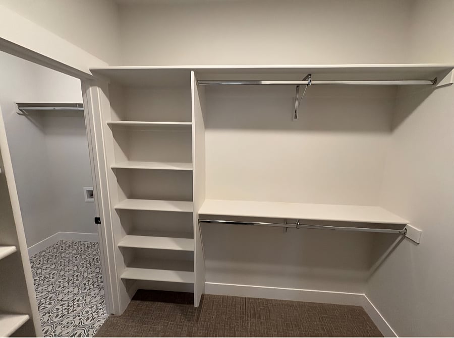 The master walk-in closet offers access to the laundry room with a privacy lock on the door.