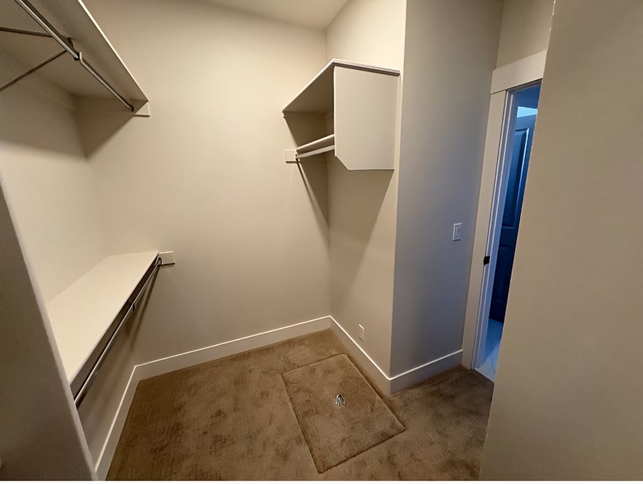 The master walk-in closet features private access to the laundry room door, which is attached and locks from the closet side for added privacy.