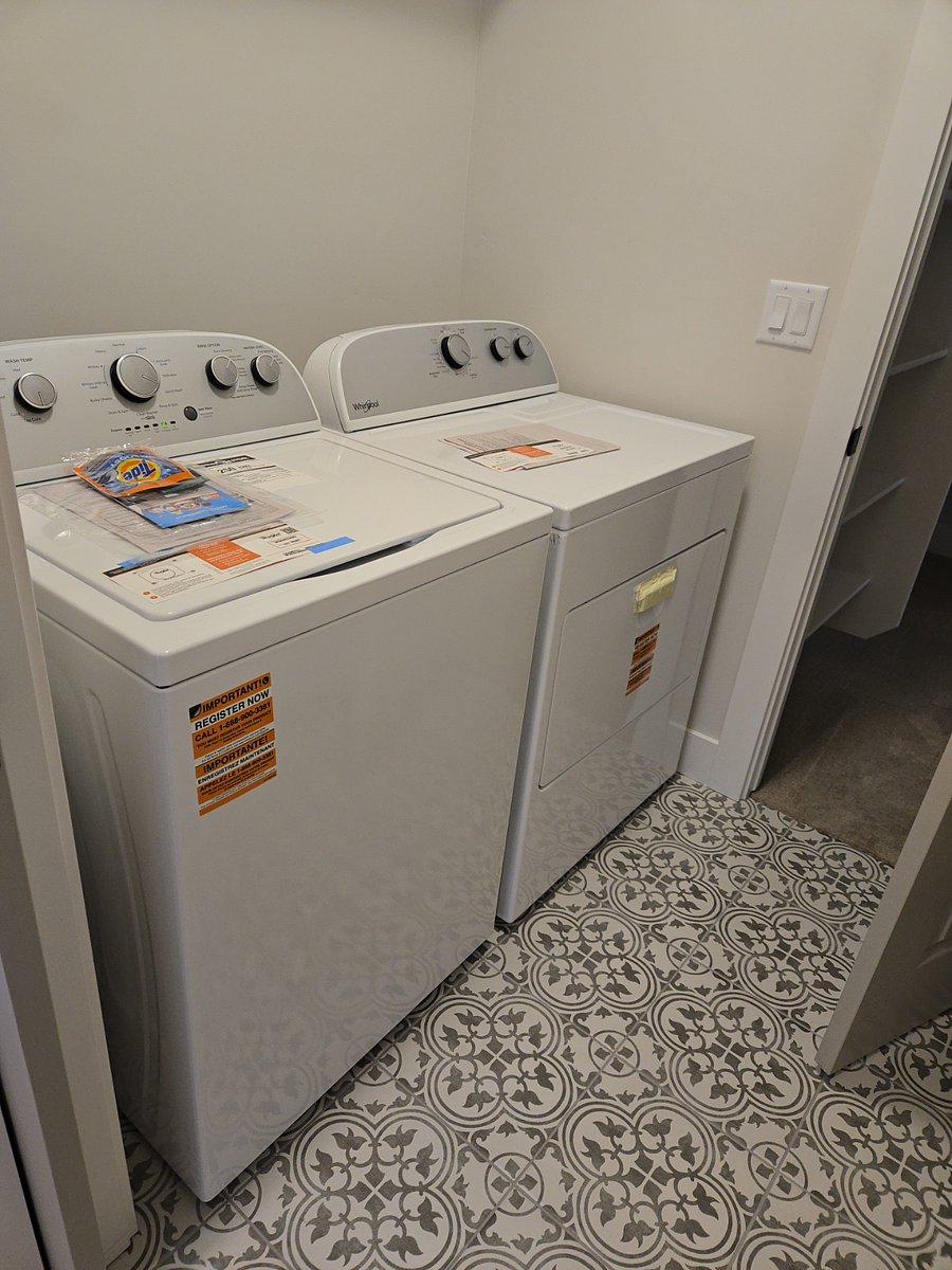 The laundry room has entrances from the hall and the master walk-in closet for added convenience.
