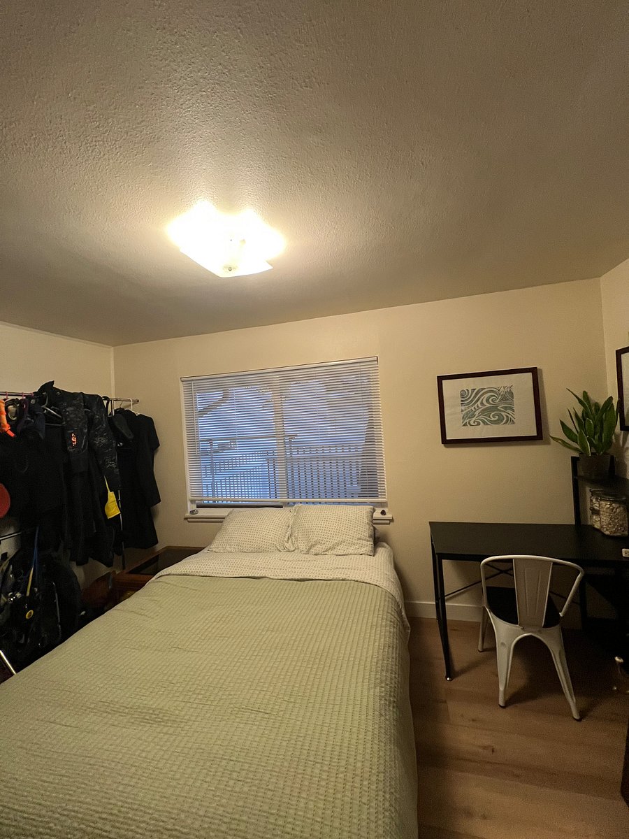 The room you'd be staying in, photo doesn't show the 2 closest available, sliding door for clothes and a small linen type closet. Hanging rack will be moved. Currently working on acquiring a better desk, dresser, and shelf