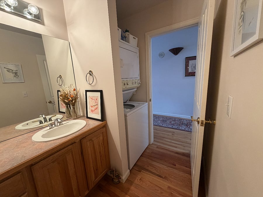 Washer/dryer is inside bathroom.