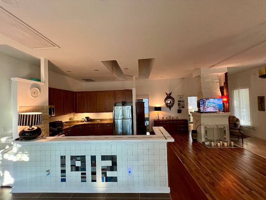 The original house was built in 1912, so it is commemorated in the design of the bar counter by the kitchen.