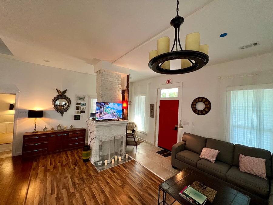 Living room with a decorative fireplace (this is the original fireplace built in 1912)