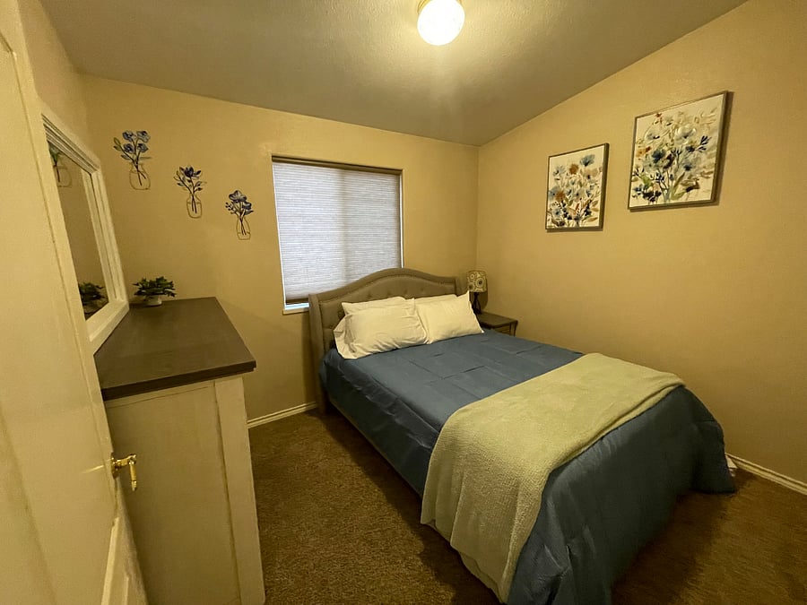 Bedroom three with queen bed.