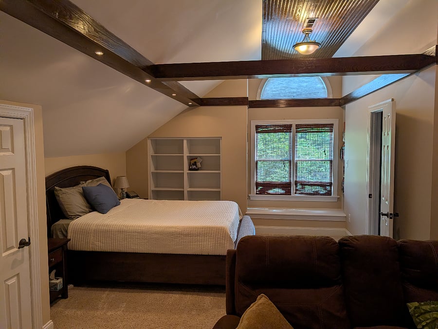 Queen memory foam bed and door to bathroom