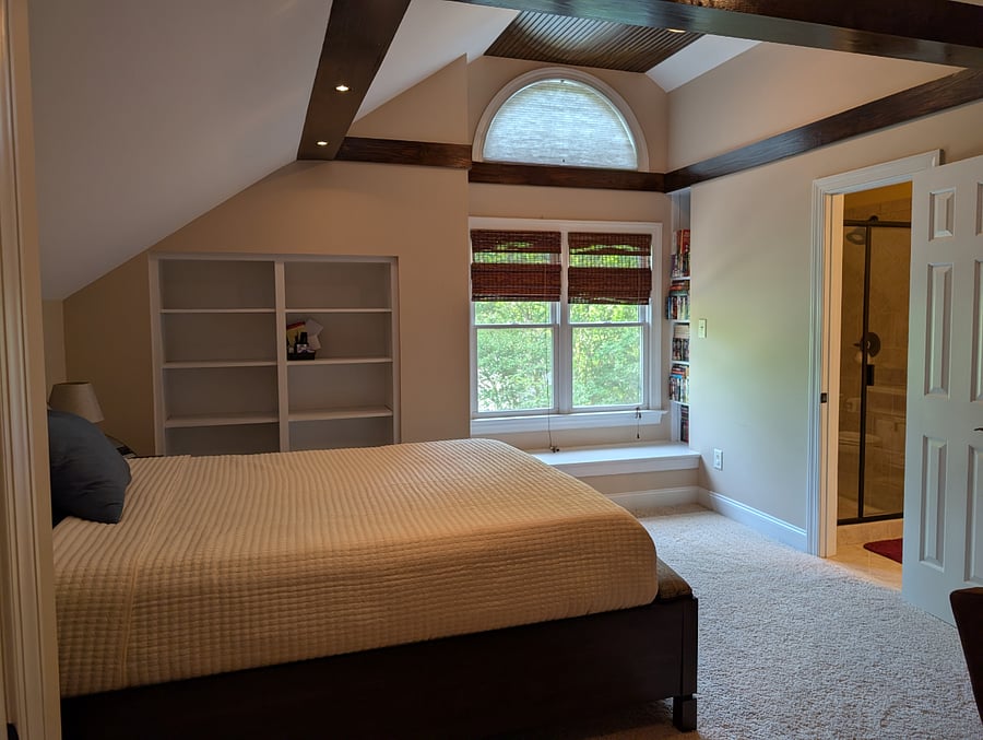 Queen memory foam bed and door to bathroom