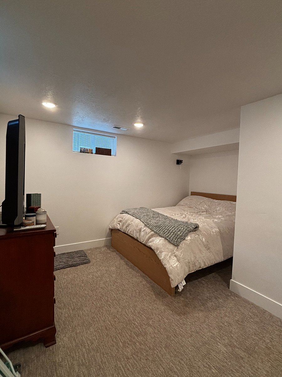 downstairs bedroom with queen bed