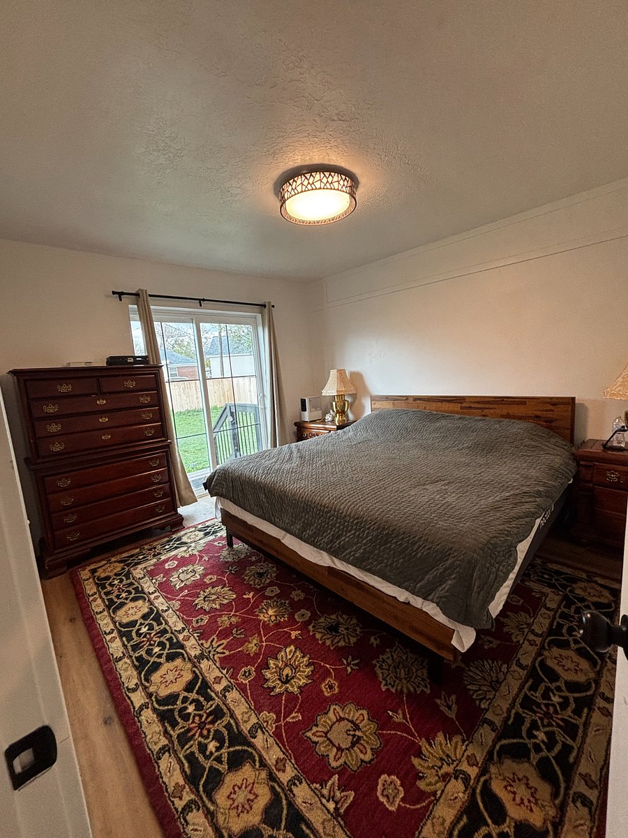 master with king bed leads to fenced backyard