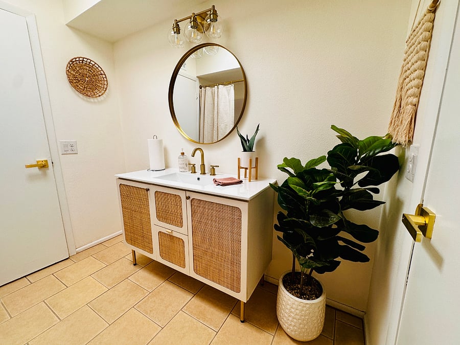 This second bathroom has a shower/tub combo.