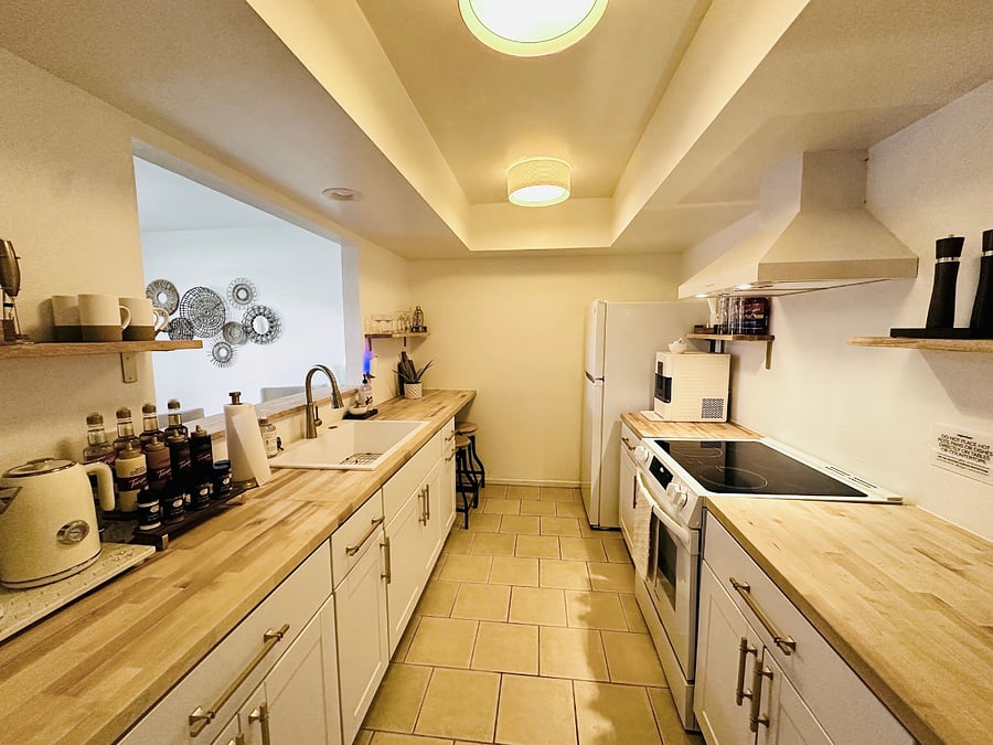 Fully stocked kitchen for all of your cooking needs. Also indulge in our fully stocked drink bar- coffee pot, Keurig, pebble ice machine, drink syrups and custom cups!