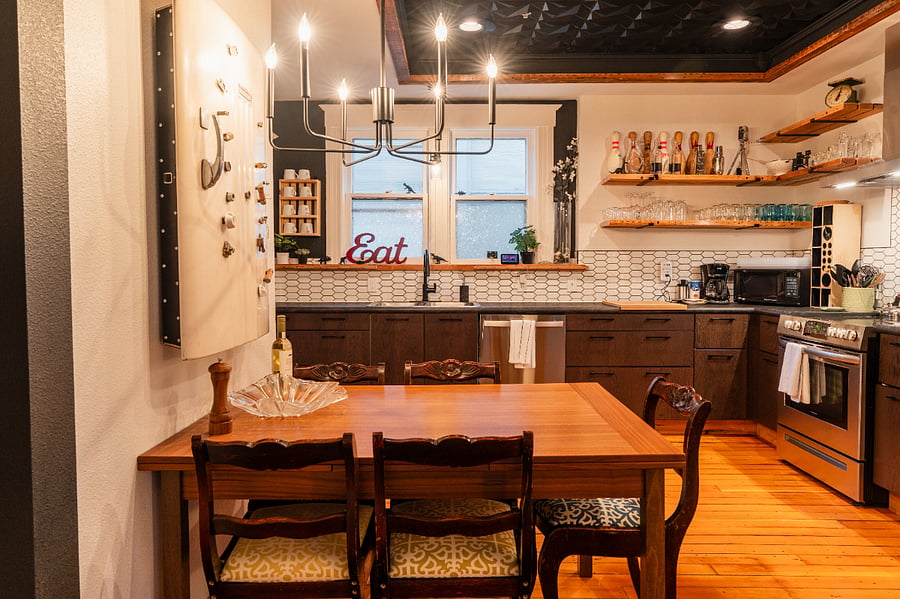 Dining Area - Eat in kitchen has large table, chairs, high ceilings, wood floors in the dining area.