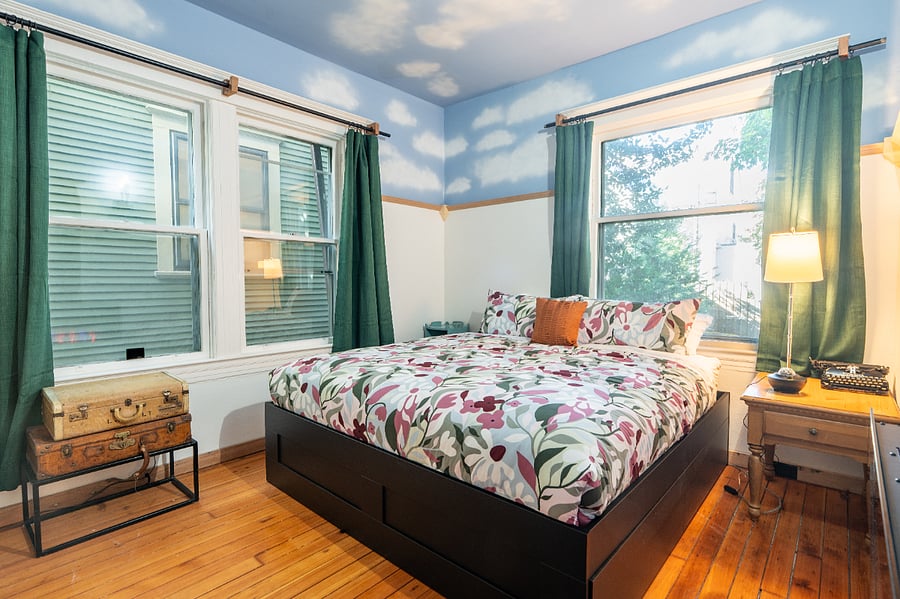 Bedroom #2 - King sized bed, high ceilings, wood floors, electric fireplace, and large closet.
