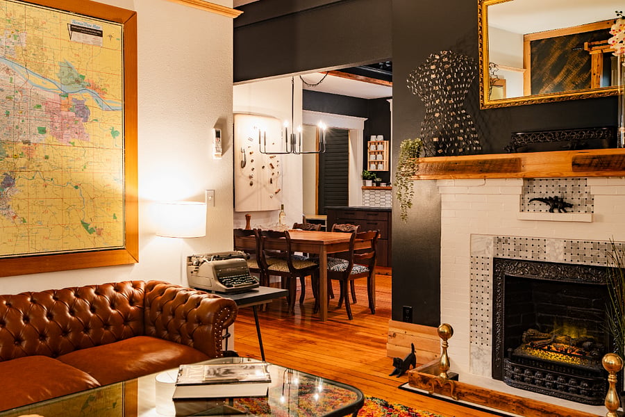 Living Room - High ceilings, electric fireplace, wood floors, bigscreen TV, and large windows seat.
