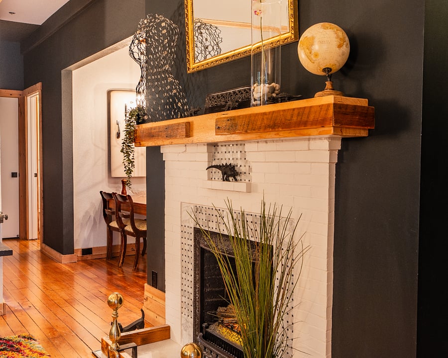 Original 1898 fireplace - it has been retrofitted with electric fireplace for ease of use.