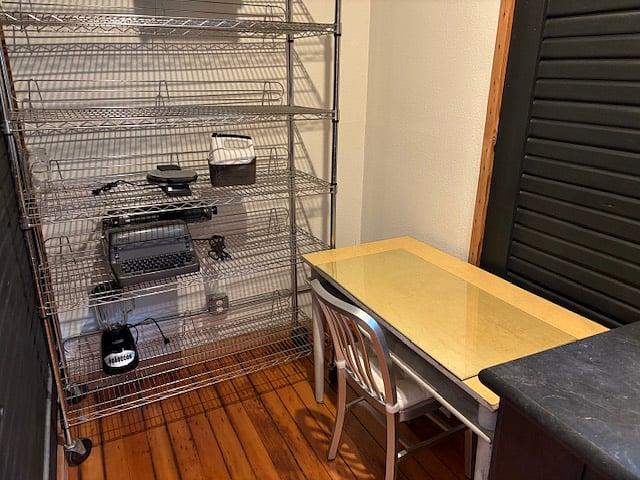 Additional work space - high ceilings and wood floors.