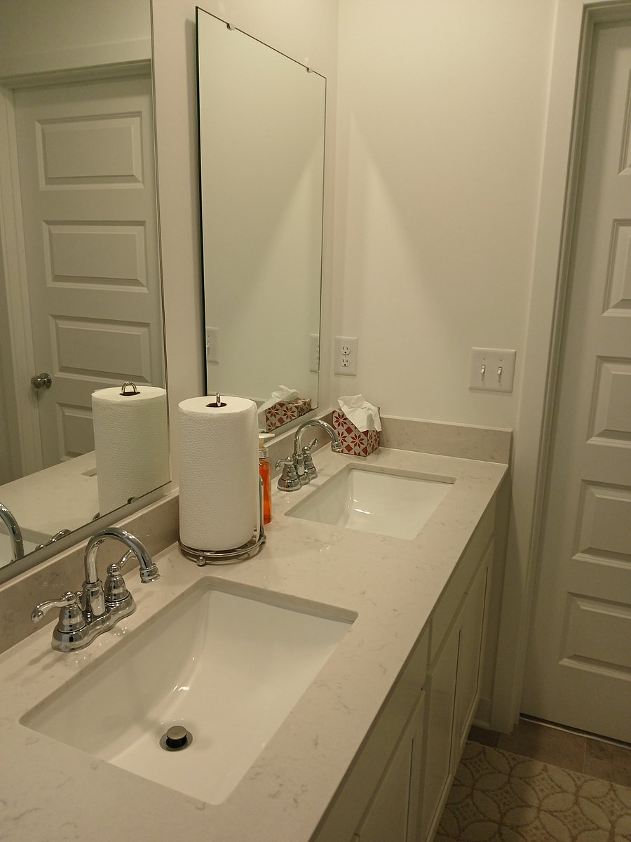 Master bath with shower, walk in closet and double sink bowl