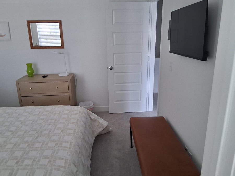 Bedroom three with wall mounted TV