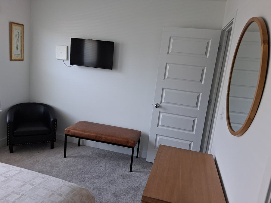 Bedroom two with wall mounted TV