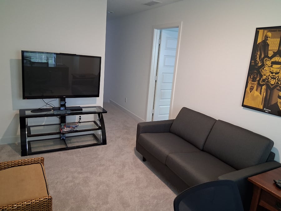 Loft with big screen TV and workstation