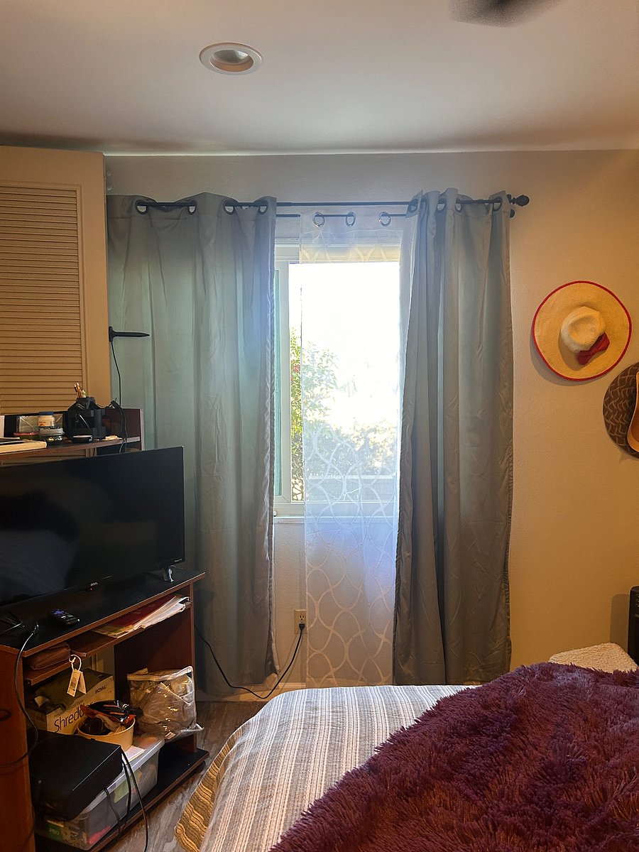 TV on master bedroom and window
