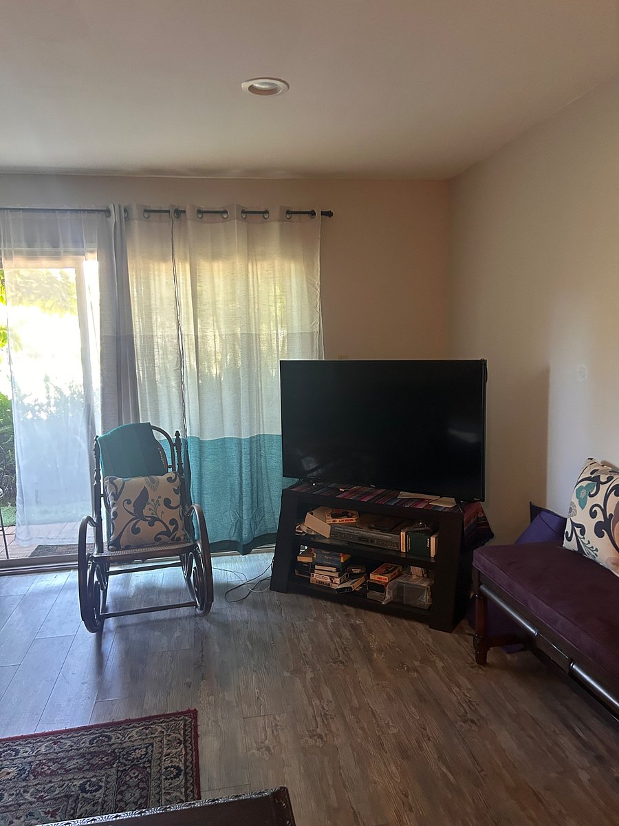 TV and rocking chair in living room