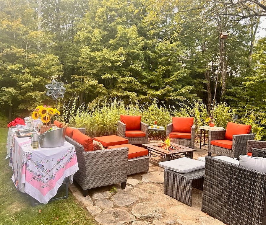 The property has a peaceful flagstaff patio with comfortable furniture and a cozy fire pit. You'll find another fire pit in the backyard behind the playground. A perfect place for the family to gather.