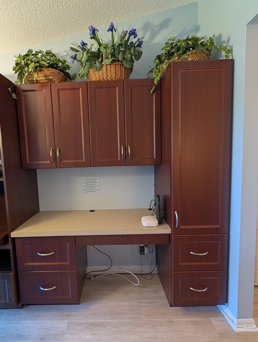 office in the den space, along with storage units and cabinets