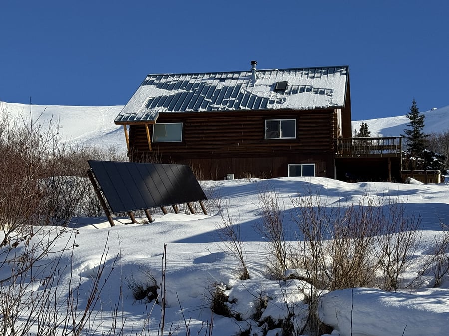 Solar panels and view of the house from the driveway