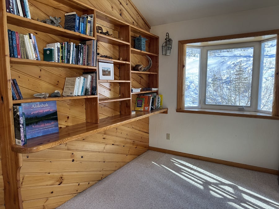Loft with keyboard, books, and games