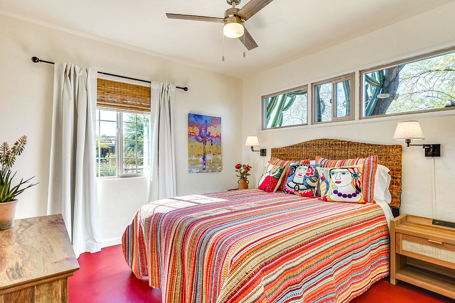 Front bedroom with luxury queen size mattress pull-down blinds and curtain to the front of house. Window above bed equipped with 50% sun shade screening for coolness and comfort. Large closet with shelfs and hangers, a dresser and two bedside tables.
