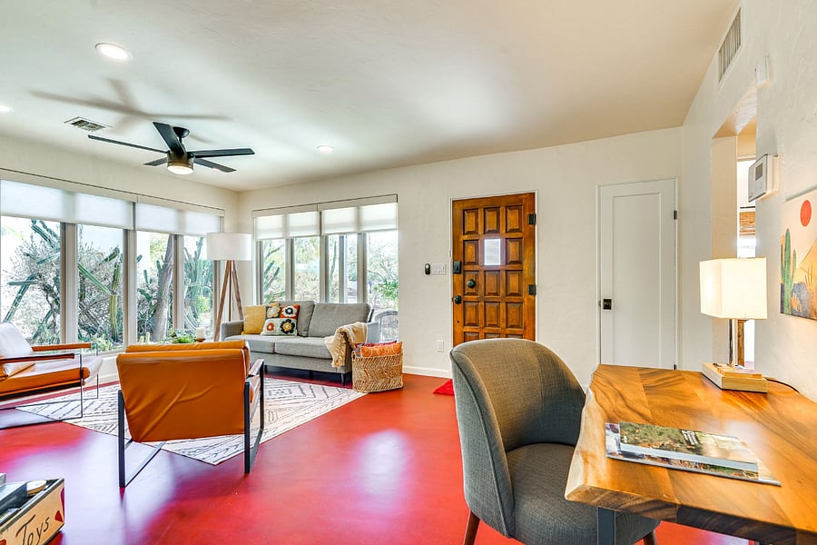 Front room is light and bright with two walls of large windows looking onto well cared for yard.