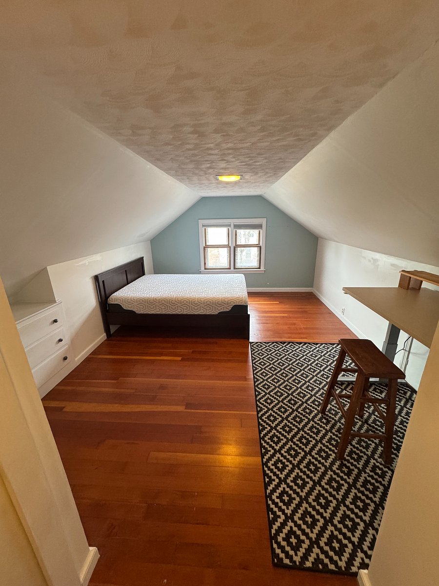 The ceiling in this bedroom is about 7ft at the highest. I am about 6'2" and it isn't too bad for me to move around in. It is very manageable unless you are quite tall. There are built in dresser drawers next to the bed, and I also have drawers for under the bed.