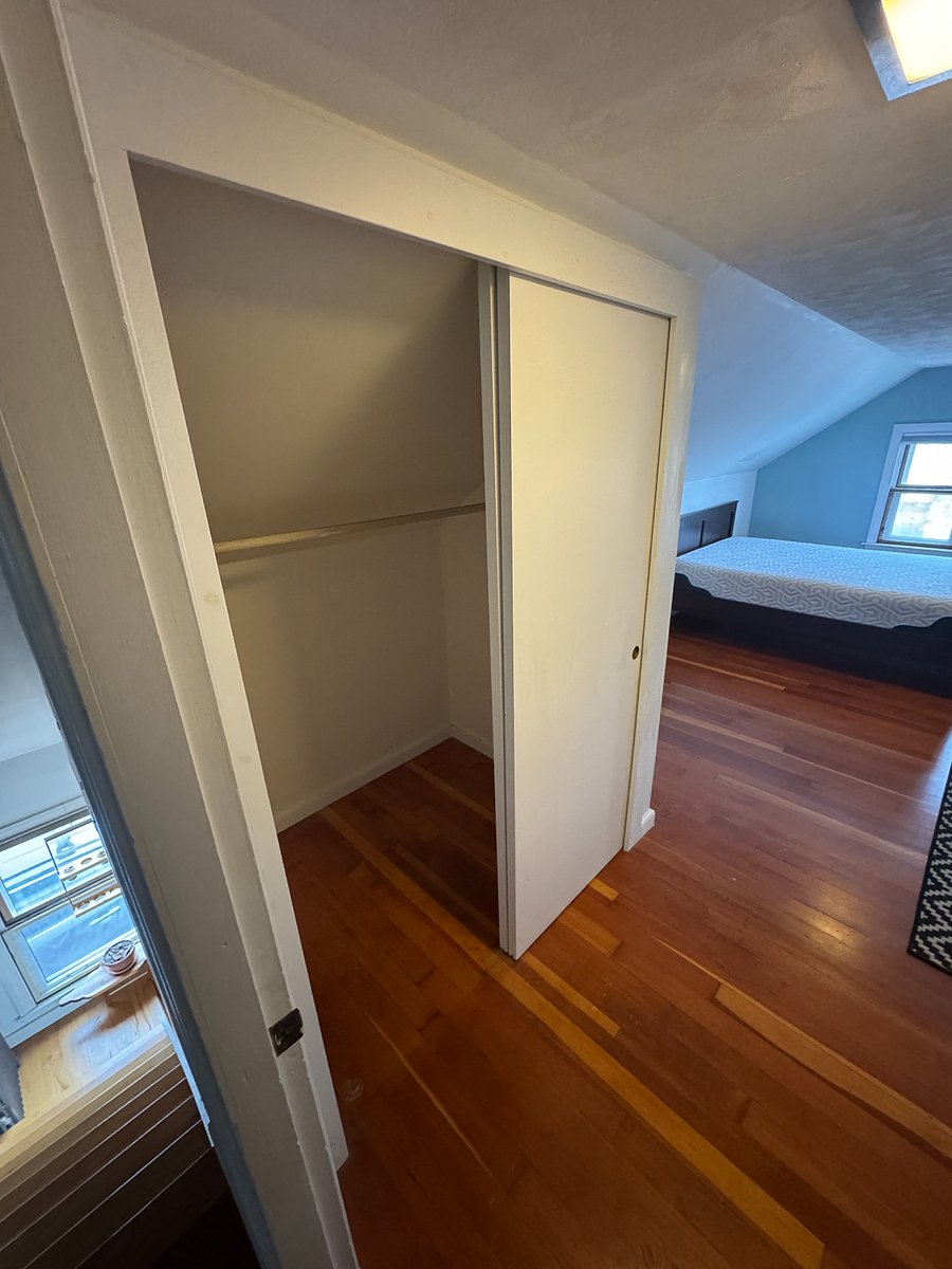 This shows the closet in the renters bedroom. It is 5ft wide and 4ft deep. It has a curtain rod and a lot of hooks.