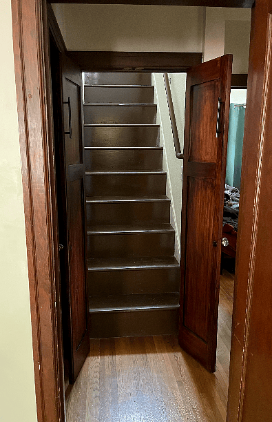 French doors leading up the stairs to the 2nd-floor suite