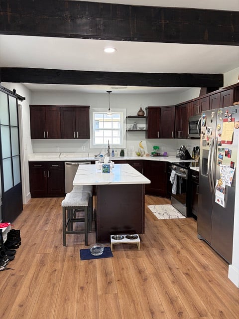 Kitchen with dishwasher, microwave, toaster, full pantry