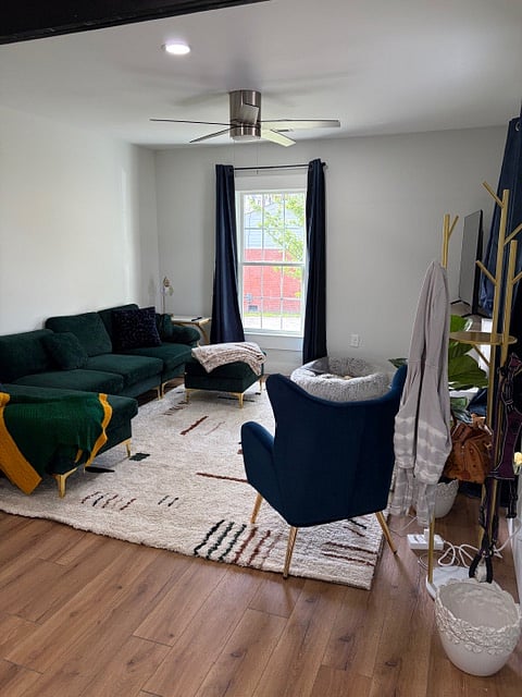 Living room with 55" smart TV and electric fireplace