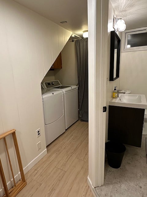 Bathroom on right, washer dryer on outside left