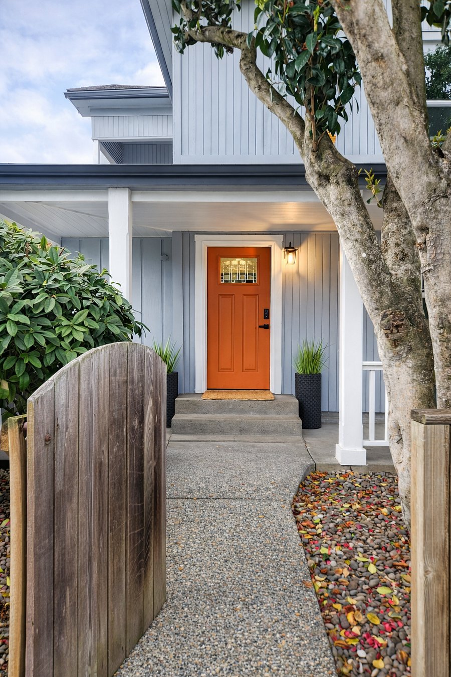 Gated entrance to front yard, and pathway to front door with key code door knob.