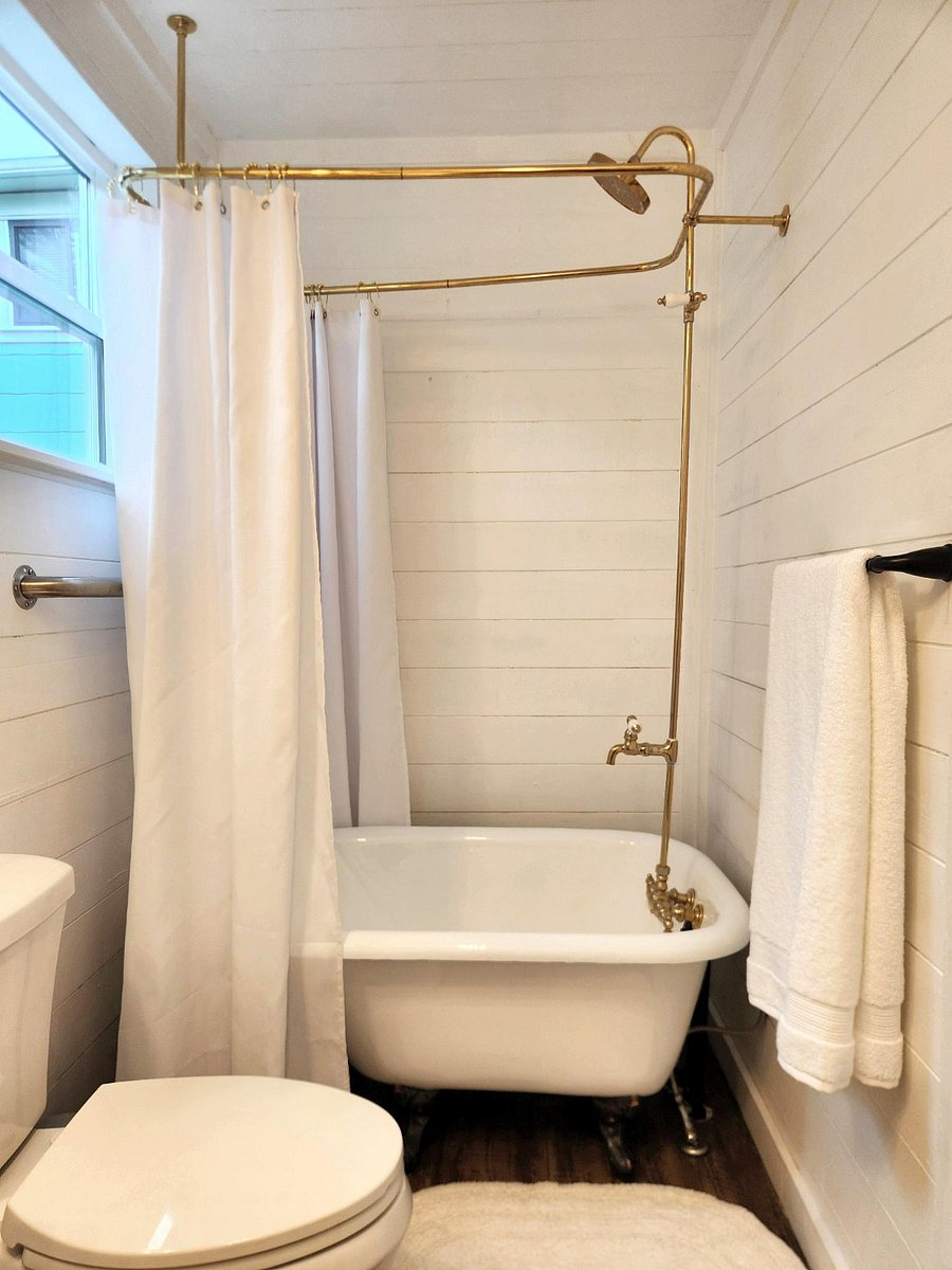Beautiful bathroom with clawfoot tub and high end, plush towels.