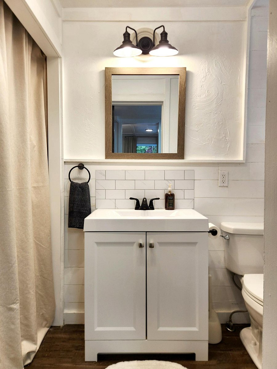 Beautiful bathroom with clawfoot tub and high end, plush towels.