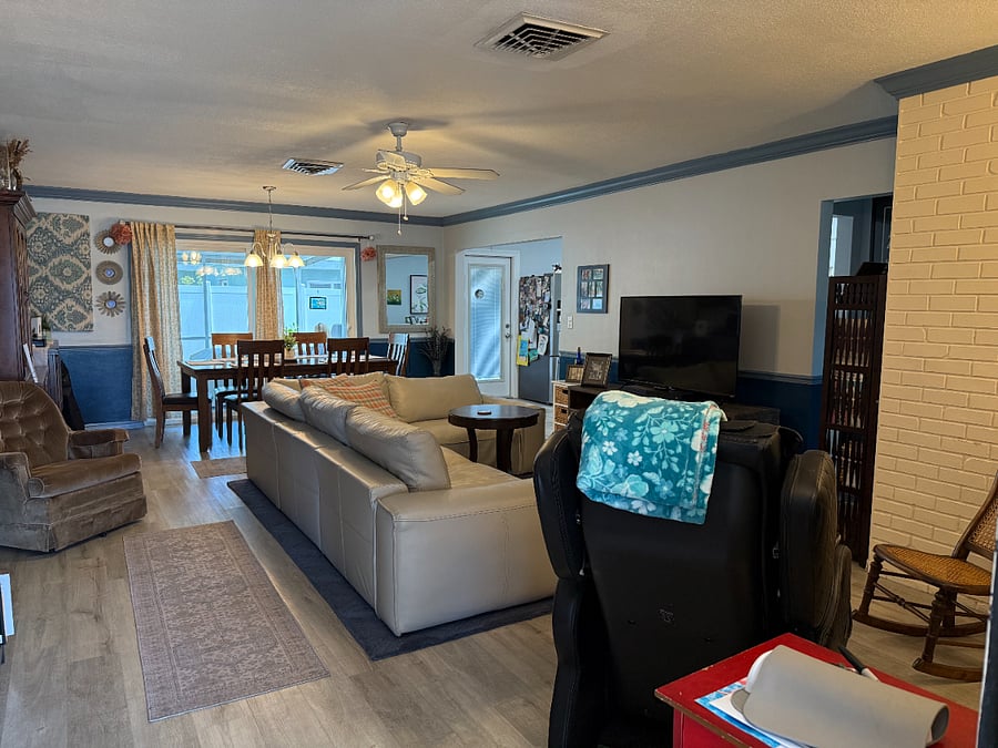 Open living and dining area with view to the back porch