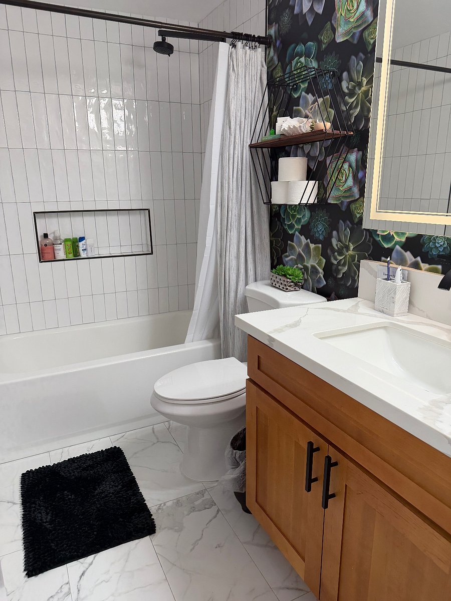 Tastefully remodeled bathroom with shower and tub.