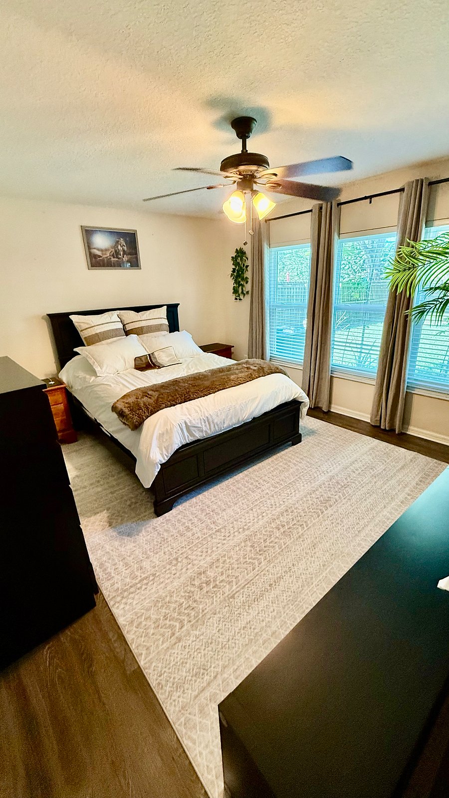 Master bedroom with smart TV and gorgeous view of private backyard