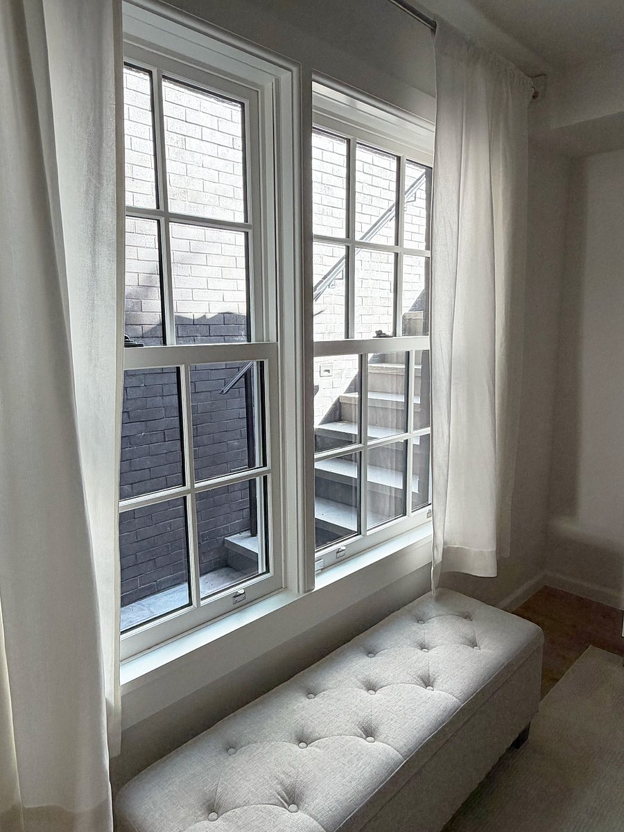 Bedroom window - view of private patio showing stairs to shared garden (stairs have pretty path lights)
