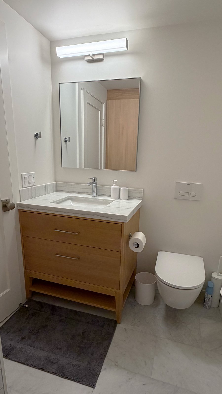 Bathroom wider view (vanity has ample countertop and large drawers)