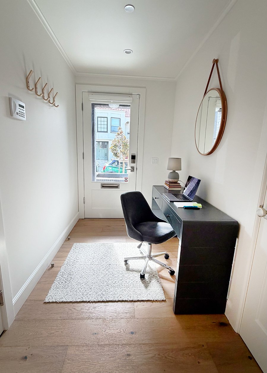 Sunny work area with desk and swivel chair (we have a larger desk chair upstairs, if needed)