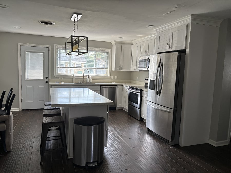 Modern kitchen, full center bar with barstools and storage