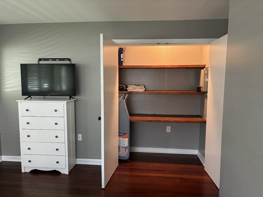 Primary bed closet (could be used as desk space); tv with streaming